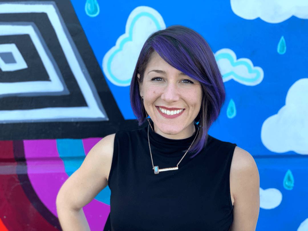 Andrea Venet infront of a colorful background